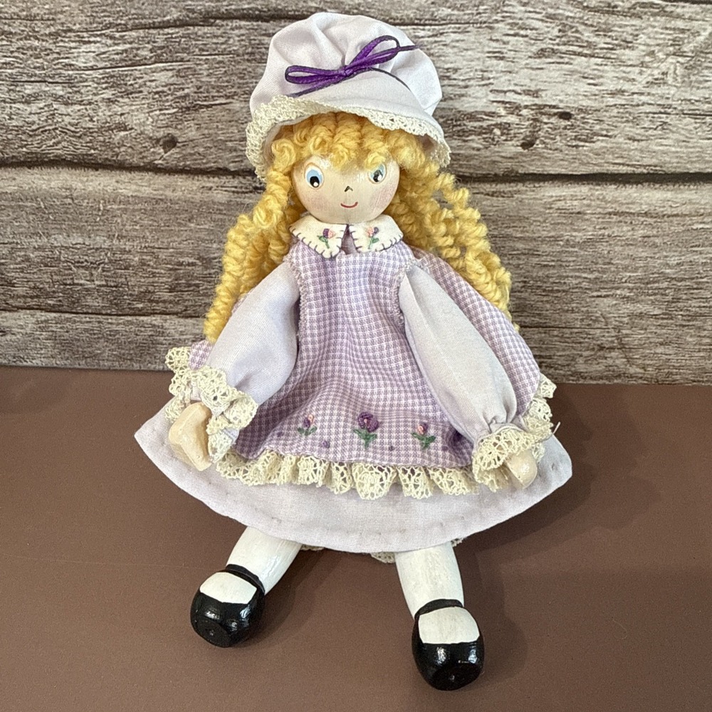 Vintage Handmade Clothes Pin Doll. 6" tall. Blonde hair. Purple dress with apron